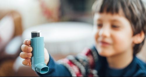 young boy with inhaler
